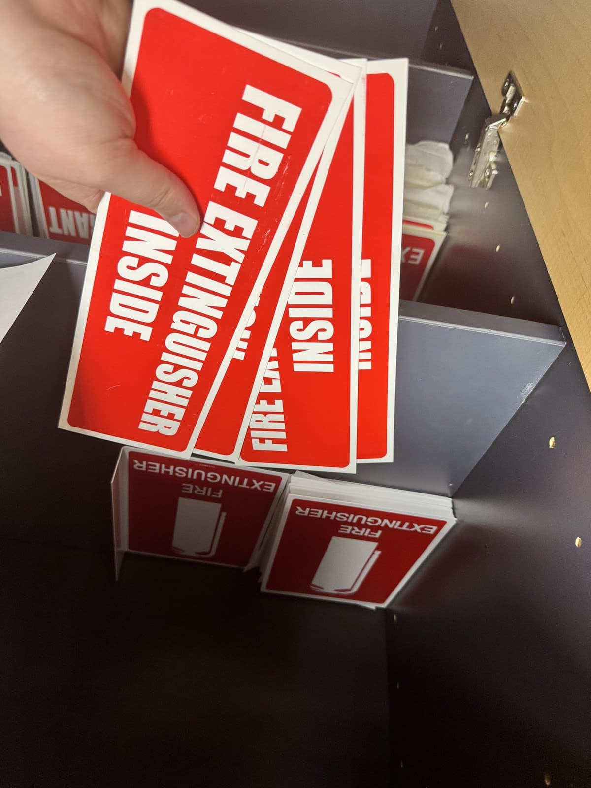 Fire extinguisher signage and equipment