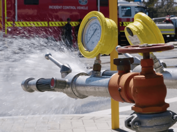 EFS technician performing fire equipment inspection