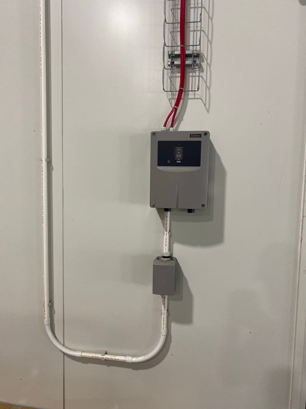 Aspirating smoke detection panel in a freezer zone