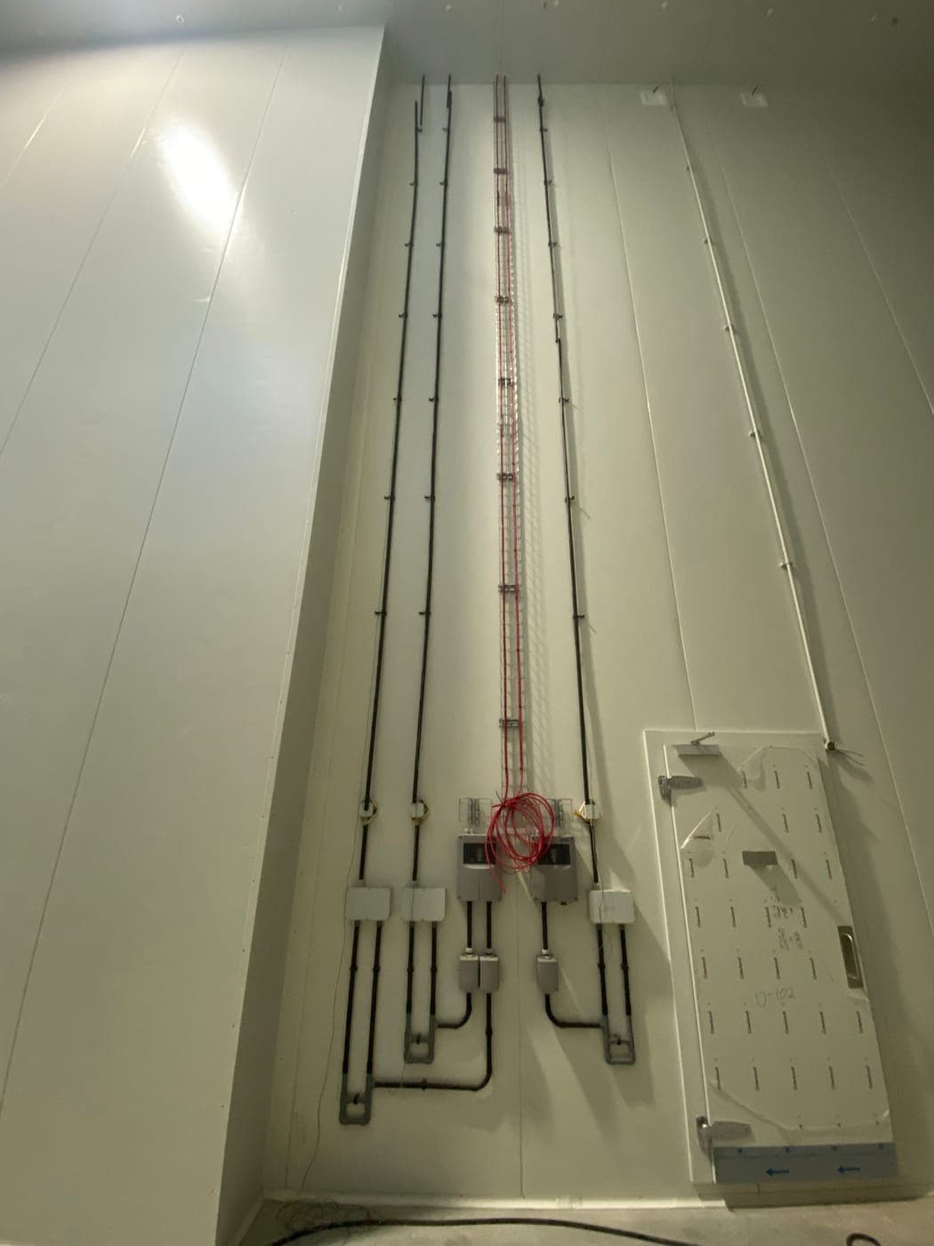 Aspirating smoke detection sampling pipework in the freezer