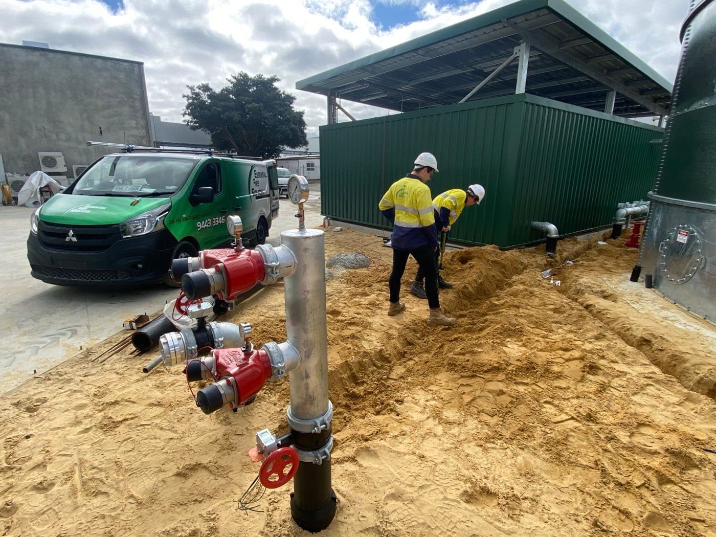 EFS crew installing the hydrant booster and underground fire main