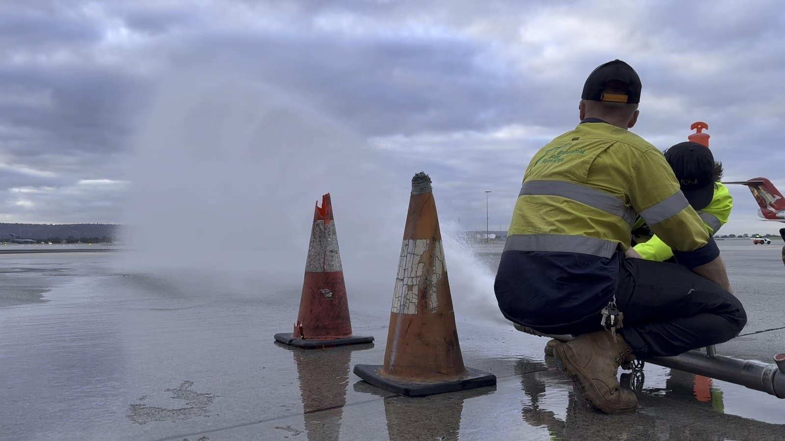 EFS technician testing hydrant with water spray